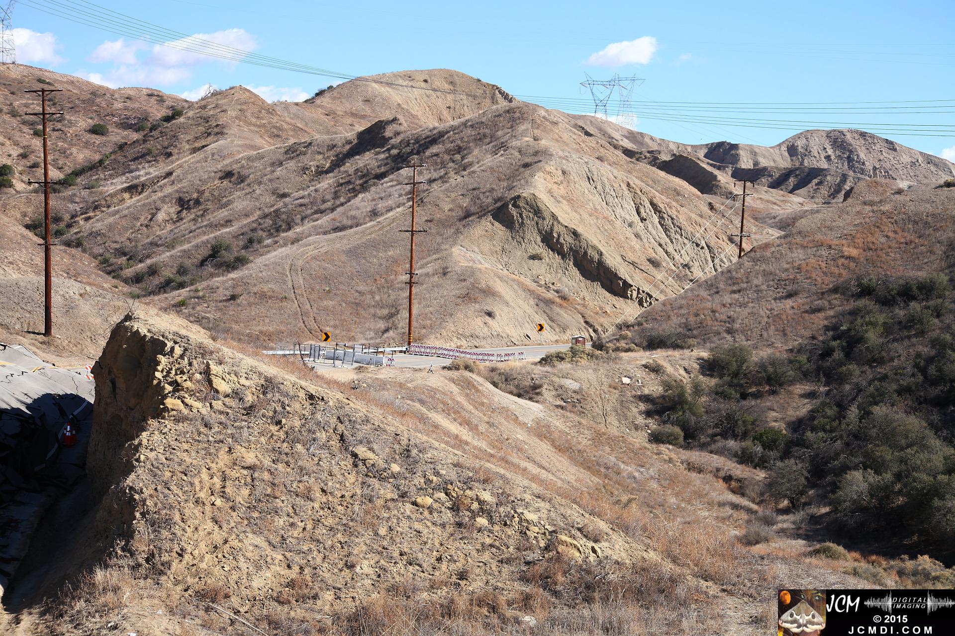 Landslide, buckled pavement, and terrain at Vasquez Canyon Road in Santa Clarita, CA filmed 11-25-2015